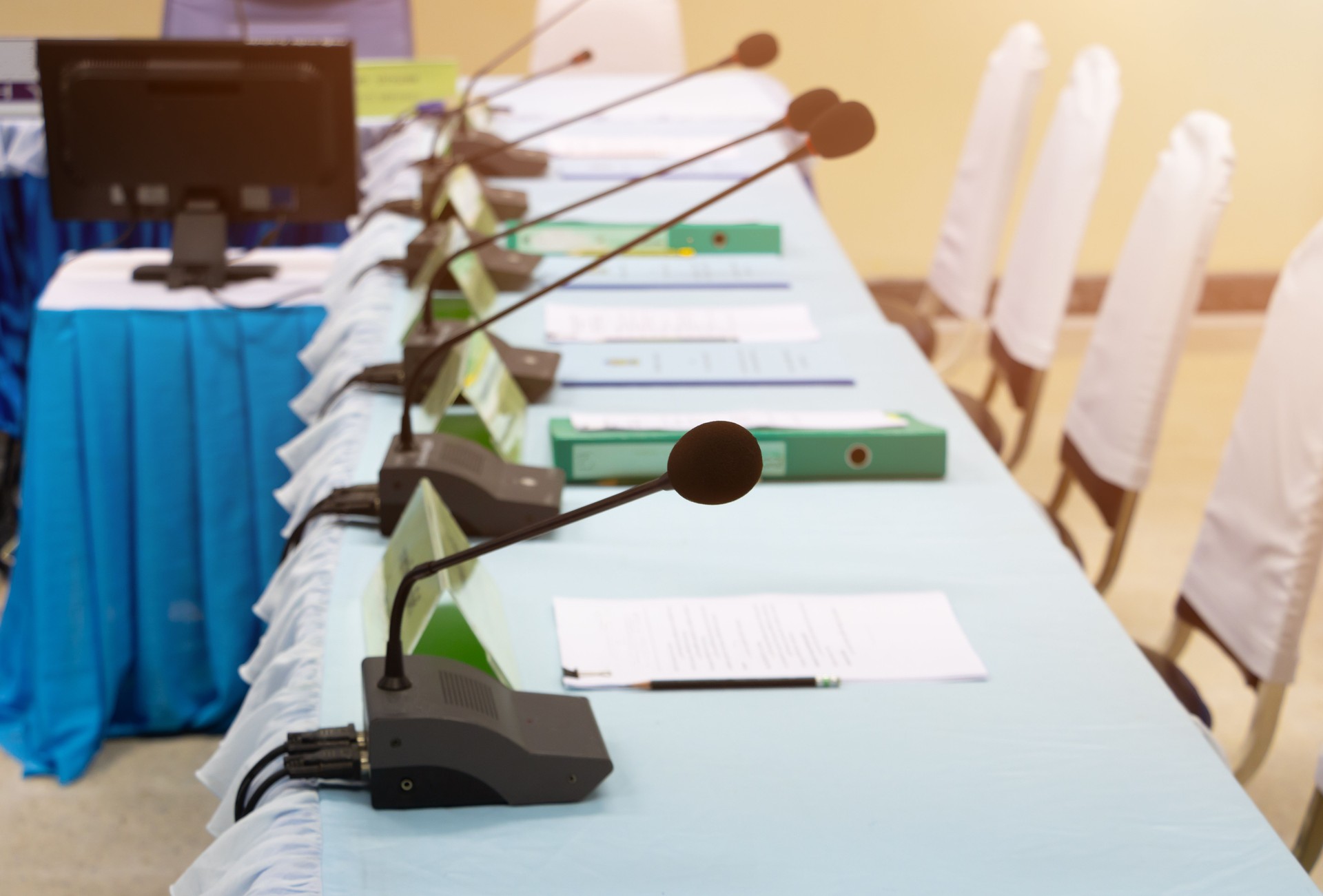 meeting room and desktop microphone file on table in office workshop presentation concepts